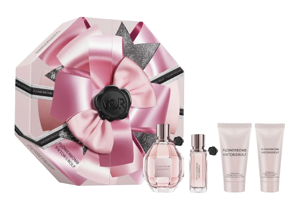Viktor & Rolf Flowerbomb Gift Set featuring a pink, bow-wrapped decorative box, a full-size Flowerbomb perfume bottle, a matching mini travel spray, and two coordinating body lotions in the signature floral scent.