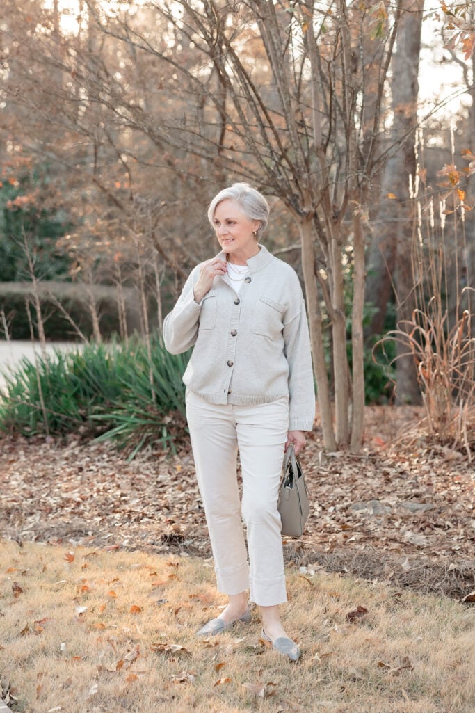 Modern classic outfit with cardigan jacket, flats, and structured handbag for mature women