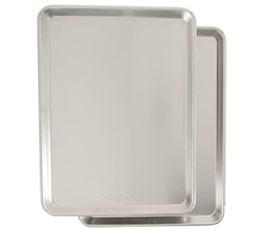 Nordic Ware Naturals aluminum half sheet pans in a two-pack. Durable rimmed baking sheets designed for even heat distribution when roasting vegetables or baking cookies.