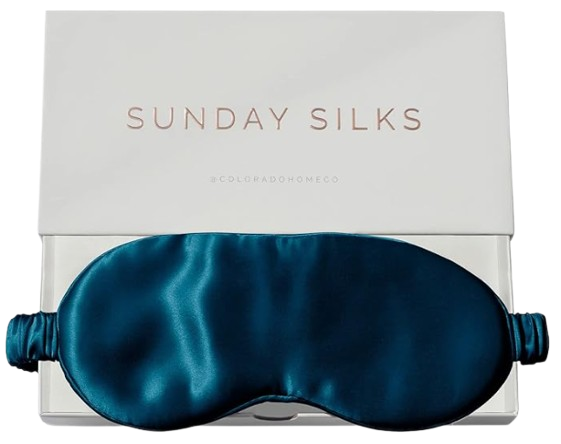 Sunday Silks silk sleep mask in deep teal, shown in branded gift box. Smooth, adjustable silk eye mask designed to block light while being gentle on skin and hair.