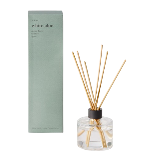 White Aloe glass reed diffuser from the Alura Homescent Collection, featuring a clear glass vessel with natural reeds and a soft green boxed package.