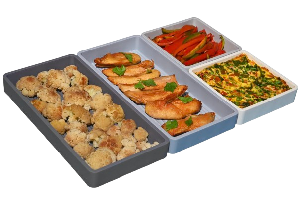 Flexible silicone sheet pan dividers separating roasted cauliflower, chicken, peppers, and egg bake, designed to keep foods separate during cooking.