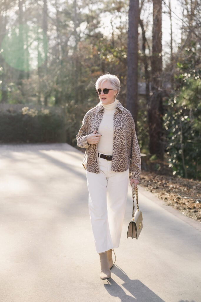 Casual chic winter white jeans outfit with leopard print jacket for women over 50