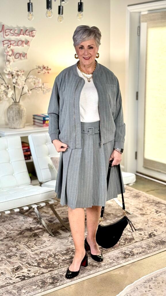 Walmart Scoop pinstripe bomber jacket and pleated midi skirt styled as a coordinated suit with loafers, affordable outfit for women over 50