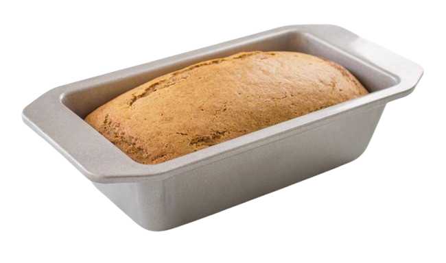 USA Pan aluminized steel loaf pan with corrugated surface and extended handles, shown with golden-brown baked bread for even heat distribution and easy release.