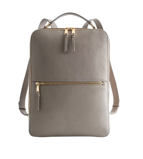 Structured Italian leather laptop backpack in soft taupe with gold hardware, top handle, adjustable straps, and exterior zip pocket for modern work style.