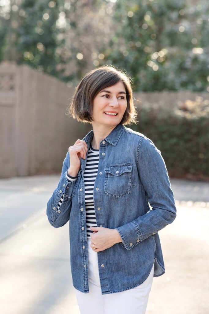 Close-up of Kelly in a striped tee with an open denim shirt — layering stripes for transitional weather