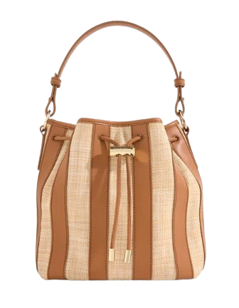 Striped raffia and tan leather bucket bag with drawstring closure, gold hardware, and structured top handle.