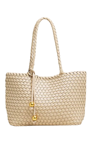 Neutral woven mini tote with braided top handles and decorative gold bead accents, featuring a soft slouchy silhouette.