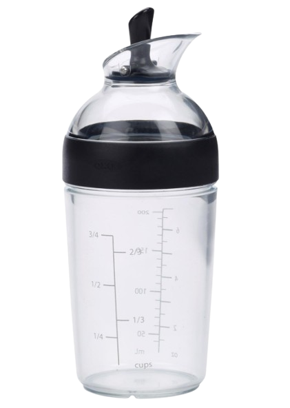 OXO Good Grips salad dressing shaker bottle with measurement markings, leak-proof lid, and flip-top spout for mixing and pouring homemade dressings.