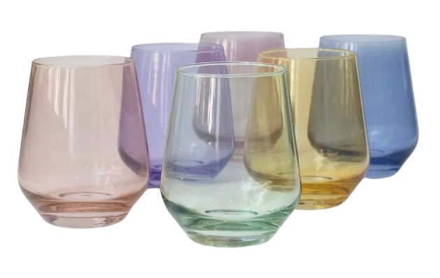 Set of six Anthropologie Estelle tinted glasses in soft pastel hues, including blush, lavender, green, amber, and blue, featuring a smooth, curved silhouette for a colorful and elegant tabletop display.
