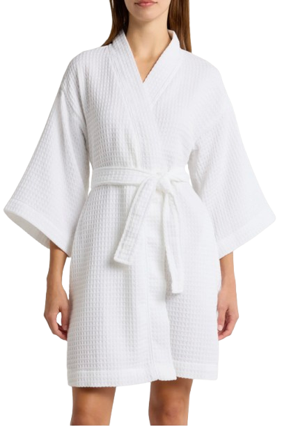 White women’s waffle robe with a textured cotton weave, featuring a wrap-front design, wide sleeves, and a matching tie belt for a lightweight, spa-inspired feel.