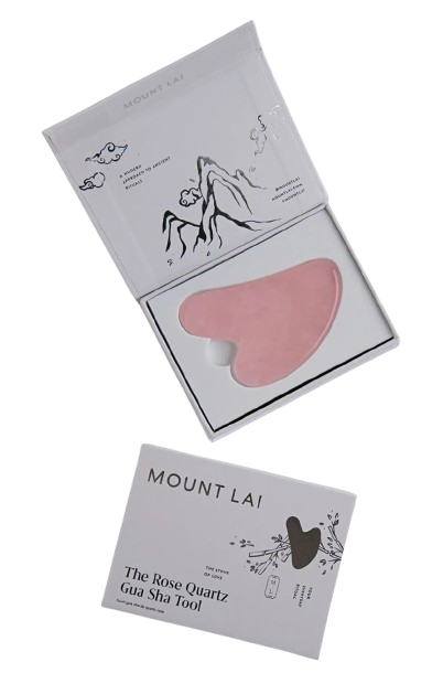 Mount Lai rose quartz gua sha facial tool in a soft pink tone, displayed in an open box with minimalist packaging, designed for facial massage and lymphatic drainage.