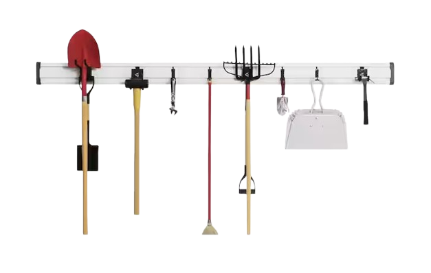 Gladiator GearTrack wall-mounted storage system with a metal rail and multiple hooks holding tools like shovels, rakes, and brooms, designed for organized garage or utility storage.