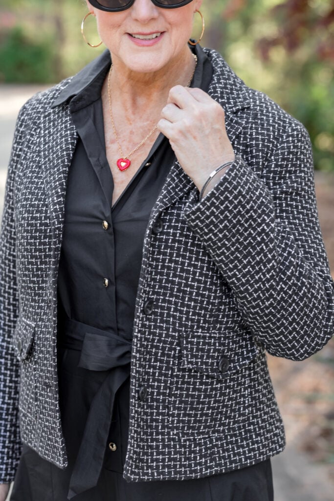 Beth wearing a black tweed blazer over a black midi dress with strappy sandals — spring dress styling for women over 50