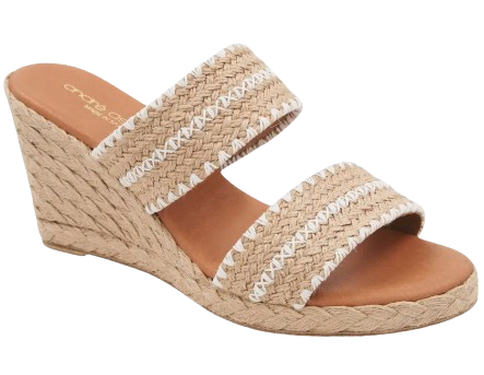 André Assous Nolita wedge slide sandal with braided raffia espadrille wedge heel, double natural woven straps with white stitching, and cushioned tan footbed.