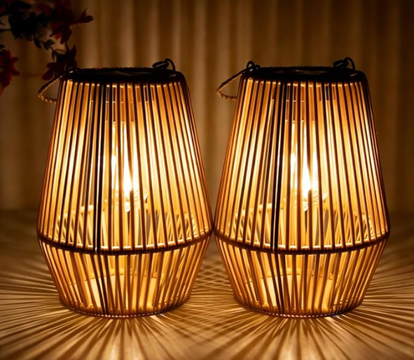 Set of two woven wicker lanterns with warm glowing LED lights, casting soft ambient patterns for cozy outdoor lighting.