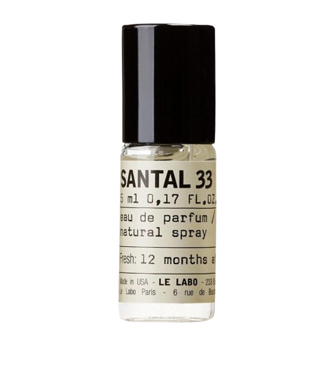 Mini glass spray vial of Le Labo Santal 33 eau de parfum with a minimalist label and black cap, sized perfectly for travel.