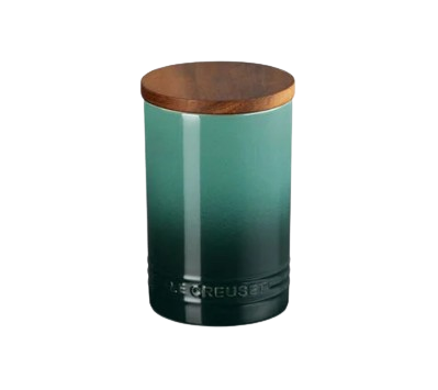 Artichaut green Le Creuset ceramic storage canister with a smooth ombré finish and a tight-fitting wooden lid, ideal for storing pantry staples in style.