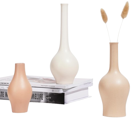 Set of three minimalist ceramic bud vases in soft neutral tones, featuring sculptural shapes and styled with dried stems on a stack of books.