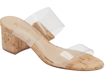 Schutz Victorie slide sandal with clear transparent straps, natural cork block heel, and open square toe design for a modern minimalist summer look.
