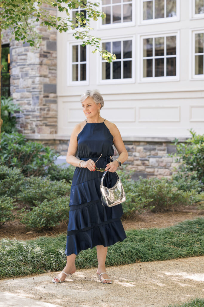 Petal & Pup Anabelle navy halter tiered midi dress for women over 50 — evening cocktail wedding guest outfit