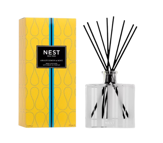 Nest New York Amalfi Lemon & Mint reed diffuser with black diffuser reeds, clear glass vessel, and bright yellow patterned gift box.