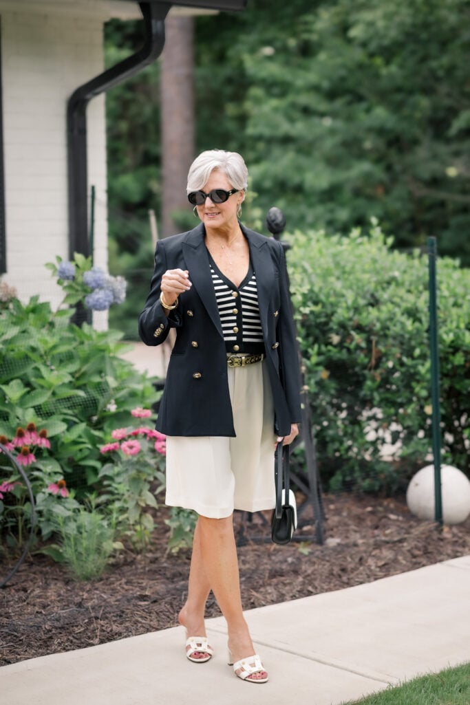 Double-faced Bermuda shorts with a striped knit vest and a tailored blazer