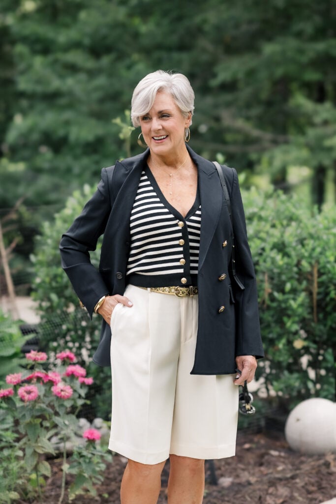 Double-faced Bermuda shorts with a striped knit vest and a tailored blazer