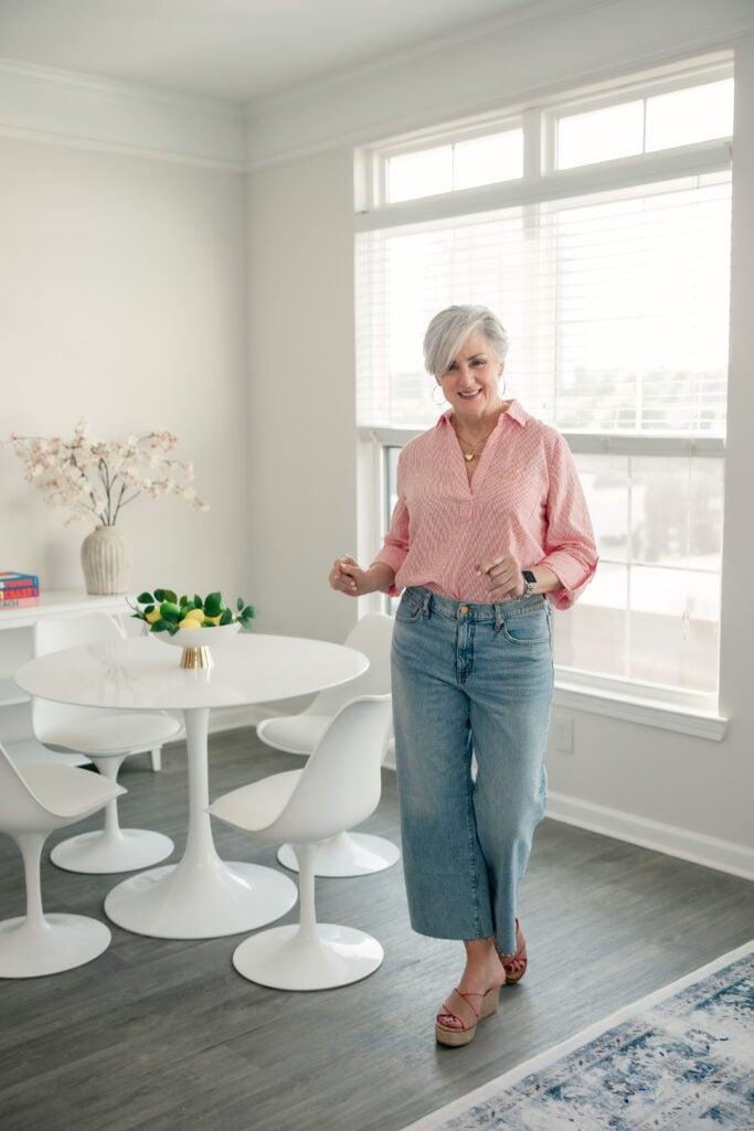 Red striped linen popover shirt with light-wash wide-leg cropped jeans — casual summer outfit for women over 50