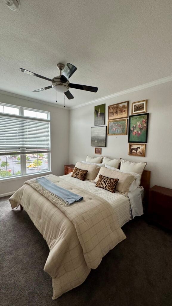 Guest bedroom in Beth's Dunwoody apartment with layered bedding, nearly finished except art and lamps
