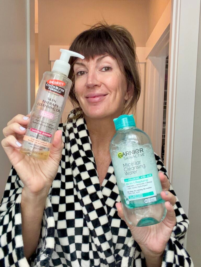 Palmer's cleansing oil and Garnier micellar water on a bathroom counter
