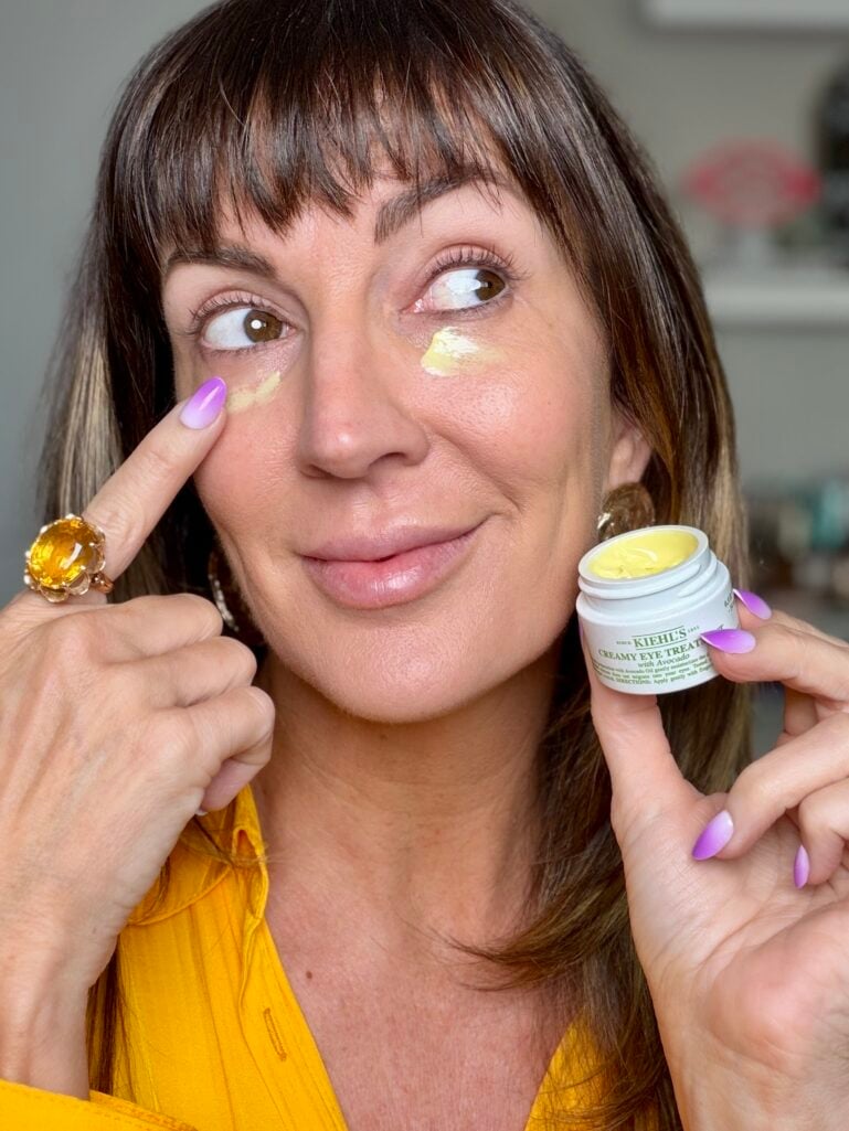 Makeup artist applying Kiehl's Avocado eye cream from the Nordstrom Anniversary Sale