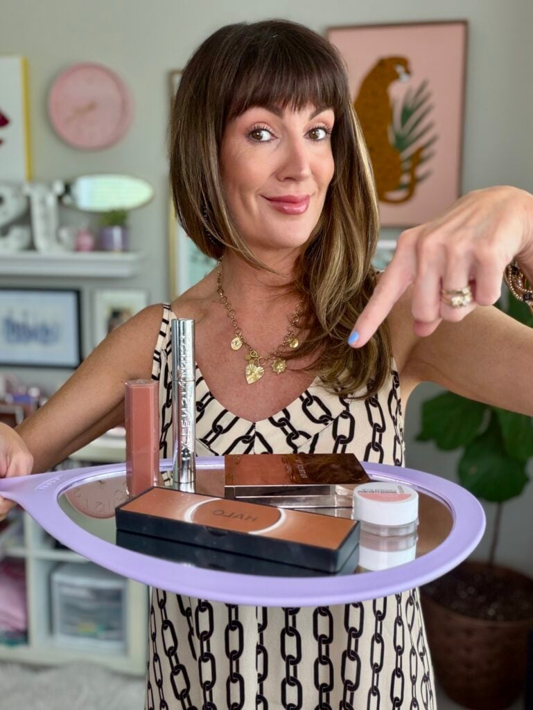 Flat lay of five makeup products used in a quick routine for women over 50.